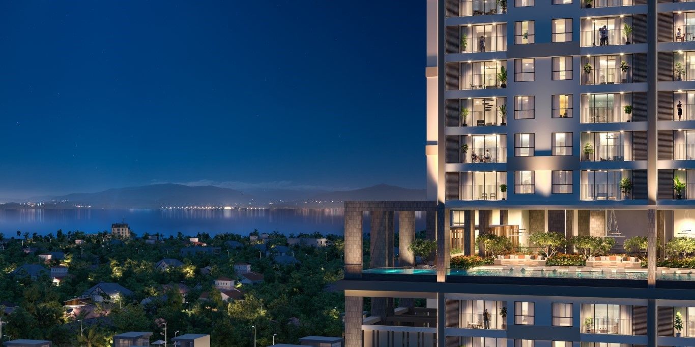 Phối cảnh tòa tháp Simona Heights Quy Nhơn về đêm với ban công kính nhìn ra biển